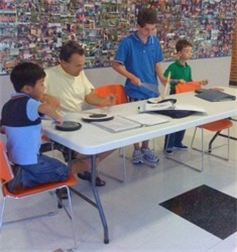 Drum Sergeant Doug Brown teaching student drummers how to read and play traditional Scottish drum music.