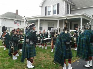 The bagpipers and drummers of the Highland Light Scottish pipe band warming up before the Thanksgiving parade in Plymouth, Ma